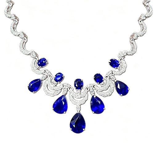 Luxury vintage bib necklace featuring 7.5ct royal blue sapphire & 0.5ct natural diamonds. Eye‑catching jewelry for evening gowns and gifting.