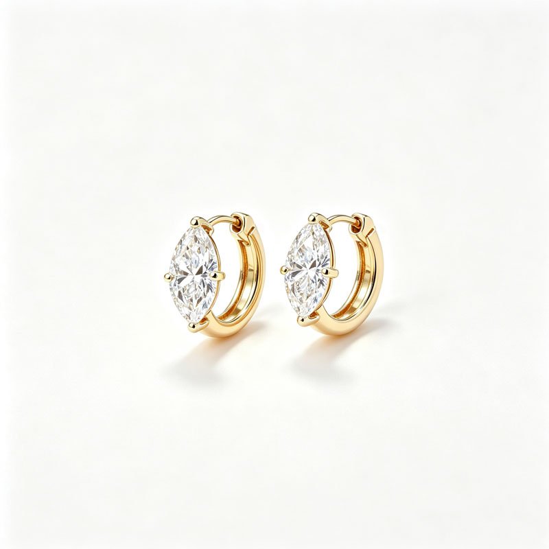 18K gold solitaire marquise diamond hoop earrings white background studio shot